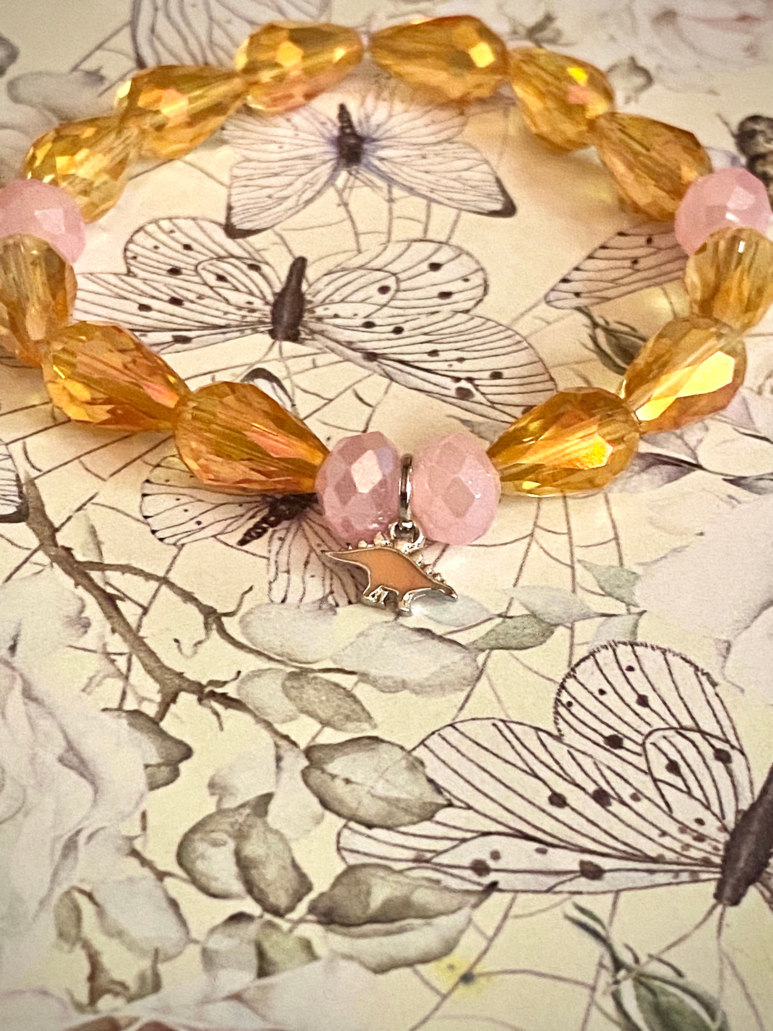 Pink and Yellow Stegasaurus Charm Bracelet